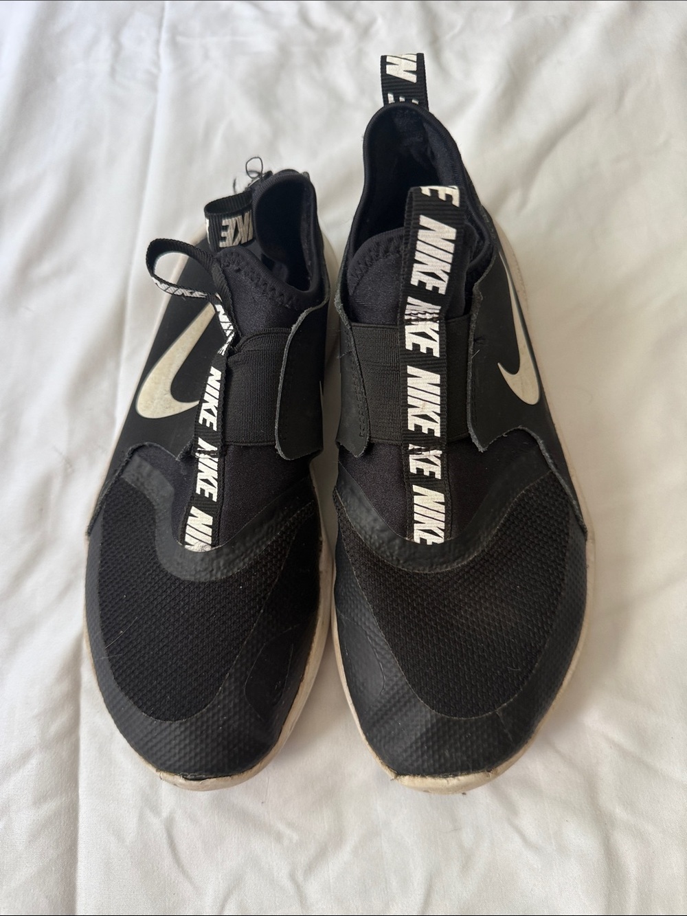 Nike Black Slip-On Athletic Sneakers with White Swoosh